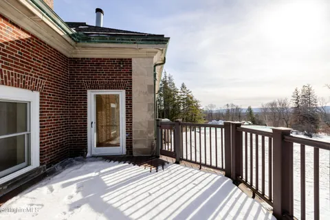 a view of balcony with wooden floor