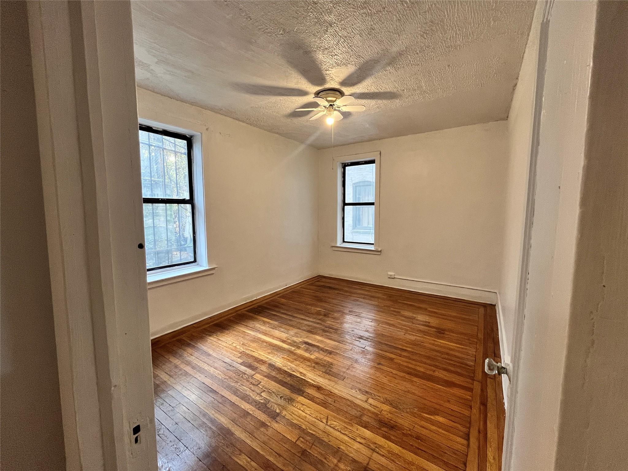 1 Caryl Avenue Yonkers, NY 10705 - Photo 1 of 1 a view of an empty room with wooden floor and a window