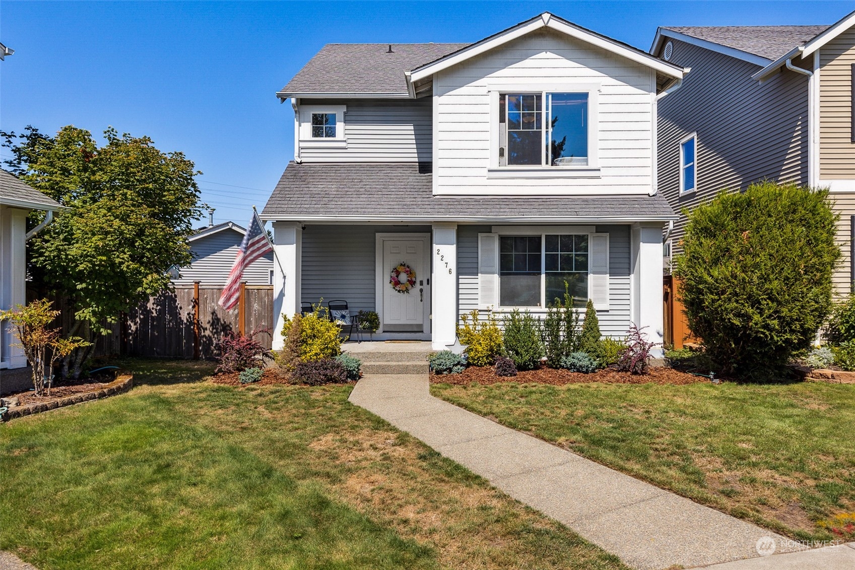 a front view of a house with garden