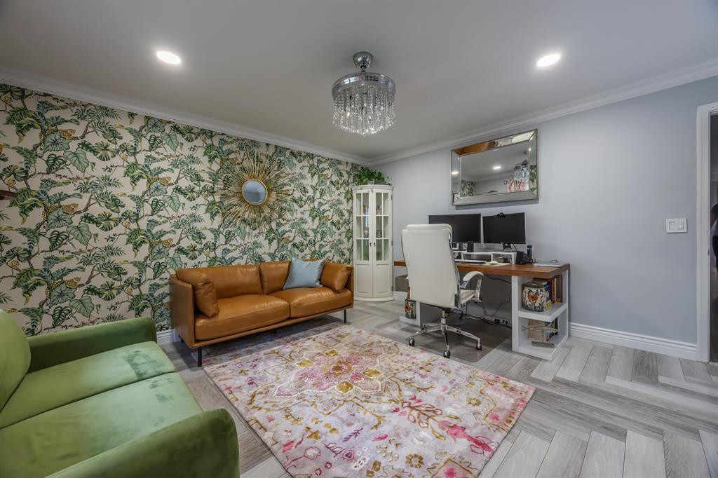 201 Southwest 1st Street, Unit 10 Boca Raton, FL 33432 - Photo 22 of 28 a living room with furniture a rug and a chandelier