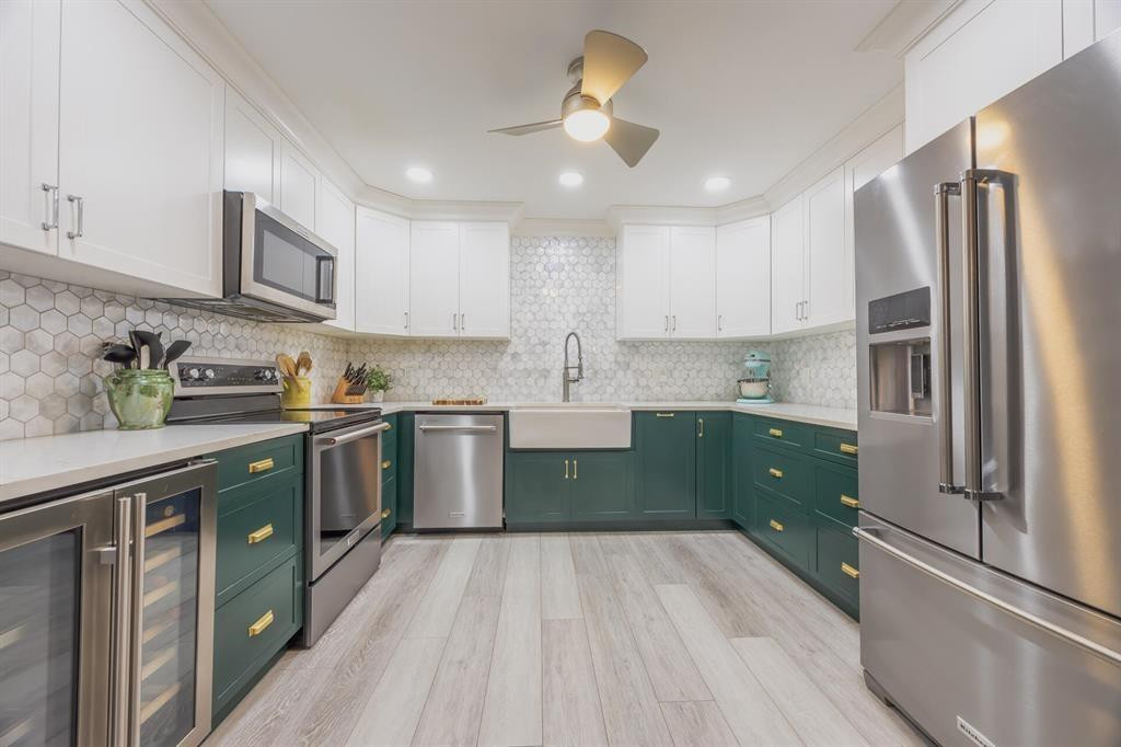201 Southwest 1st Street, Unit 10 Boca Raton, FL 33432 - Photo 8 of 28 a kitchen with a sink stainless steel appliances and cabinets