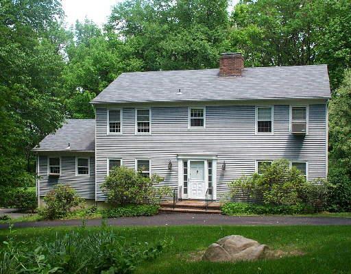 28 Parmalee Hill Road Newtown, CT 06470 - Photo 1 of 1 a front view of a house with a yard