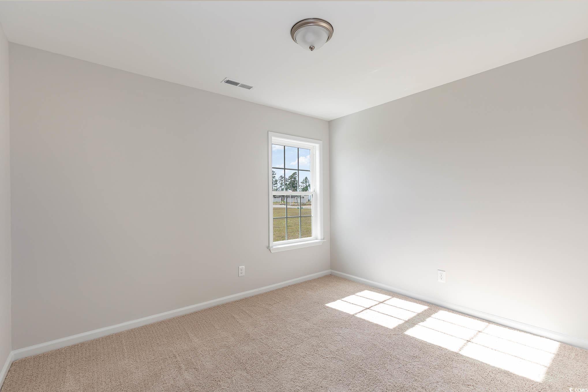 355 5th Avenue Aynor, SC 29511 - Photo 14 of 15 Empty room with carpet and baseboards