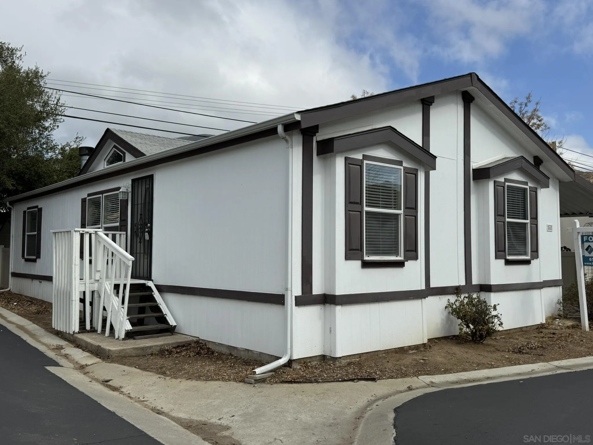3505 Alpine Boulevard, Unit 66 Alpine, CA 91901 - Photo 1 of 22 a front view of a house with a yard