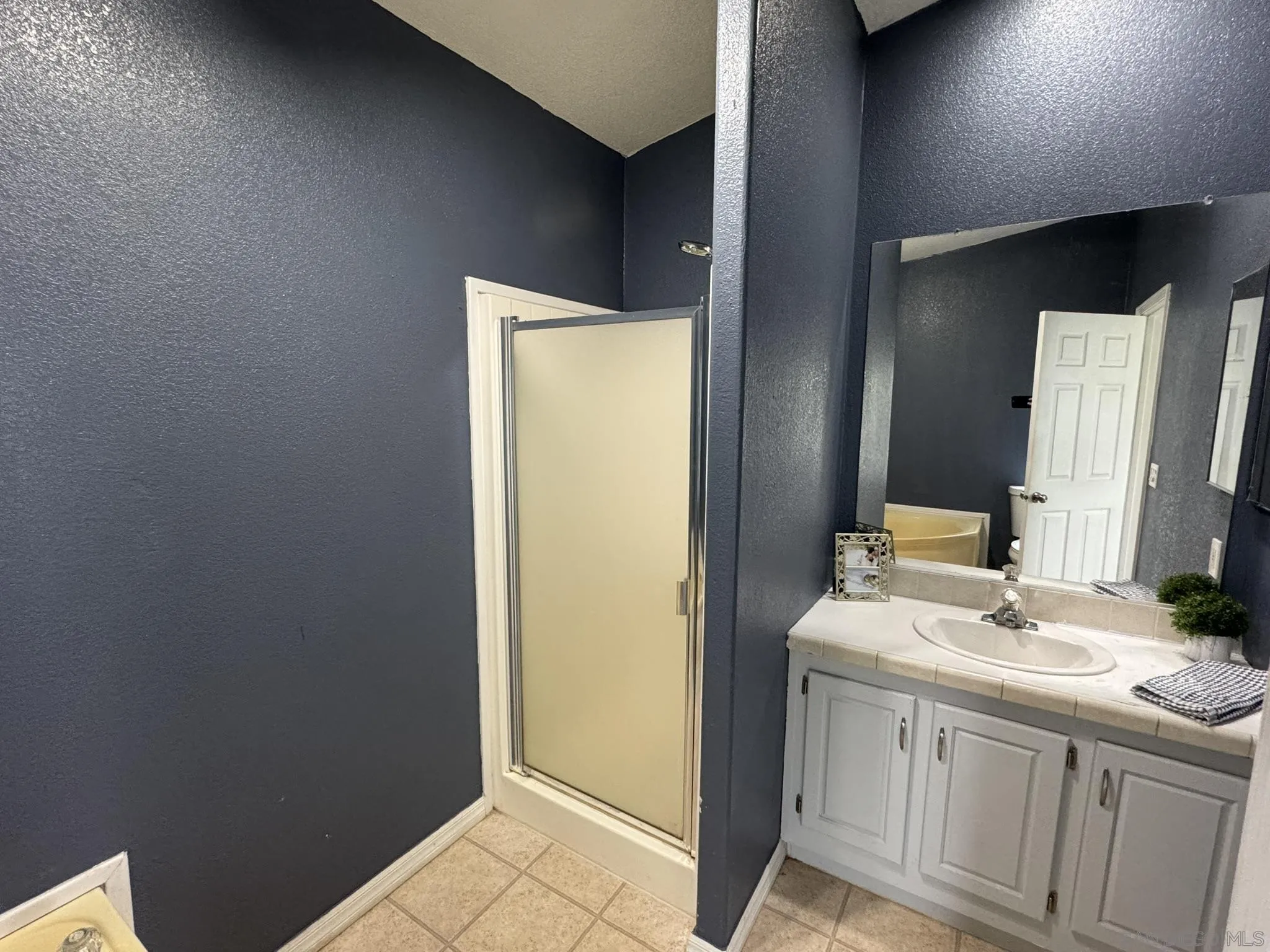 3505 Alpine Boulevard, Unit 66 Alpine, CA 91901 - Photo 13 of 22 a bathroom with a sink and a mirror