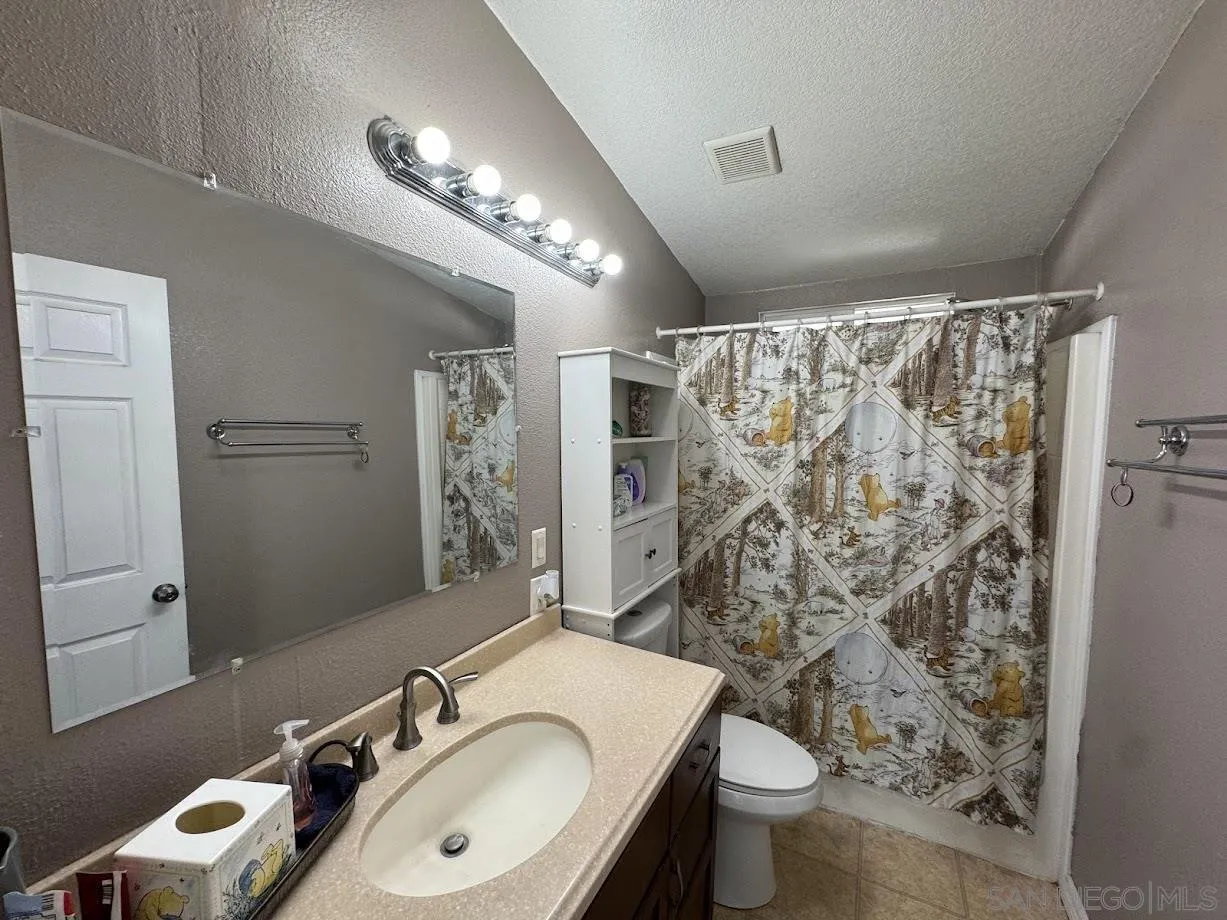 3505 Alpine Boulevard, Unit 66 Alpine, CA 91901 - Photo 15 of 22 a bathroom with a sink toilet and shower