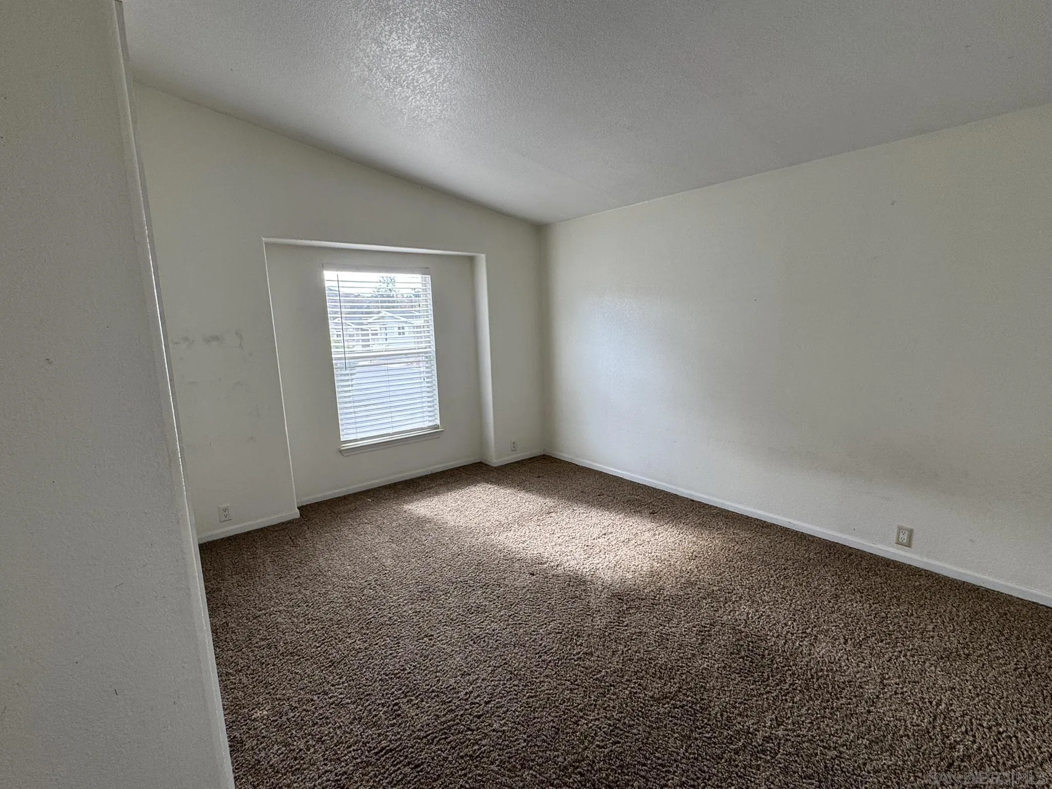 3505 Alpine Boulevard, Unit 66 Alpine, CA 91901 - Photo 16 of 22 an empty room with windows
