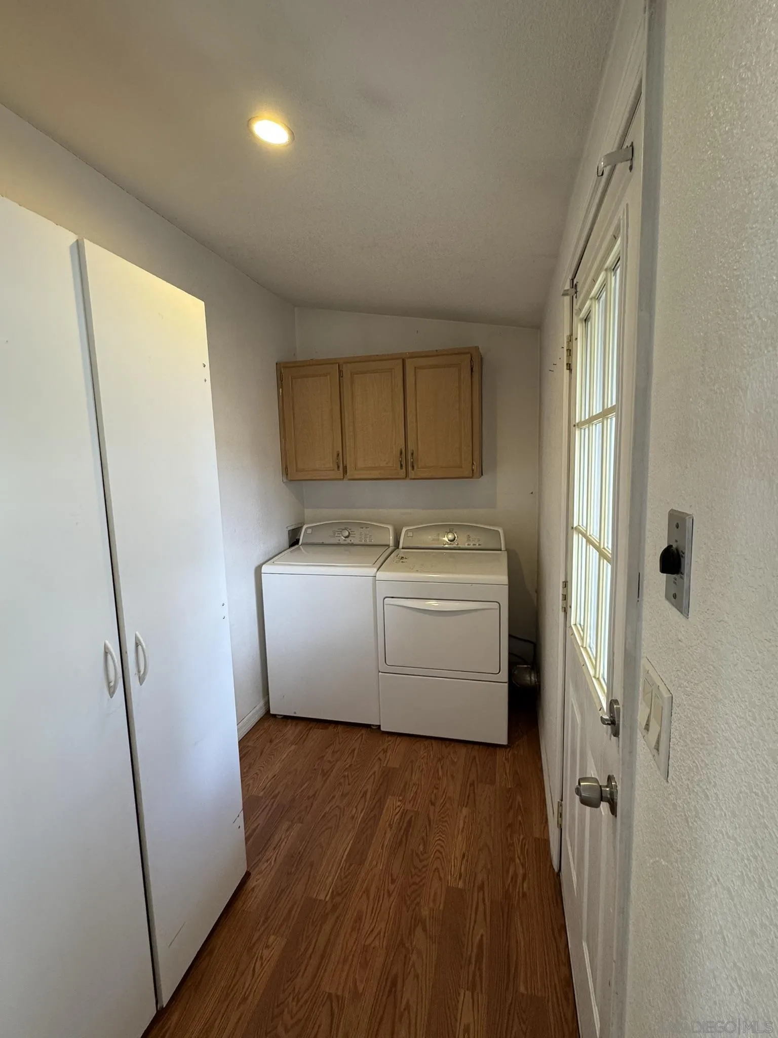 3505 Alpine Boulevard, Unit 66 Alpine, CA 91901 - Photo 17 of 22 a view of a storage and utility room with washer and dryer
