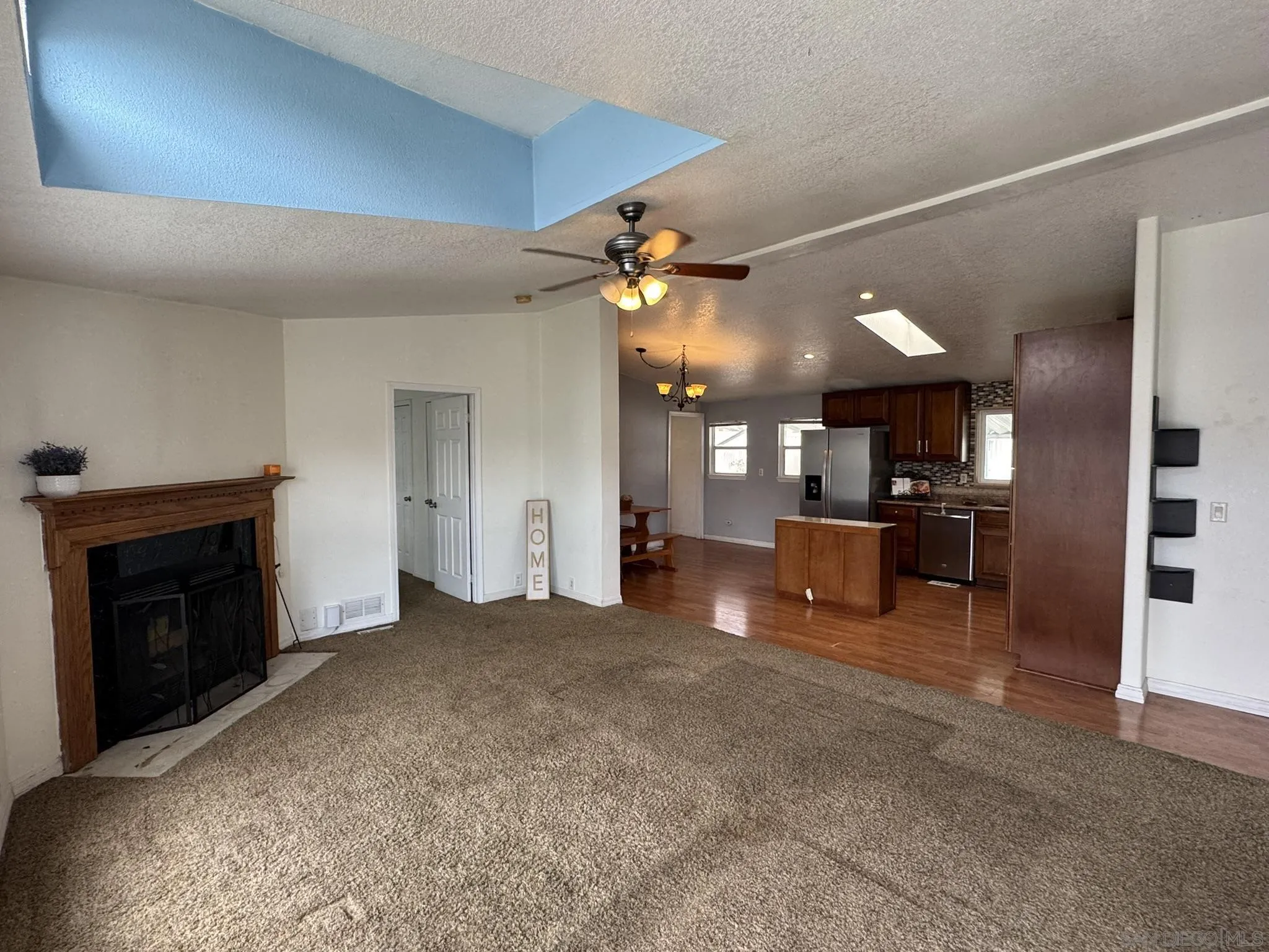 3505 Alpine Boulevard, Unit 66 Alpine, CA 91901 - Photo 8 of 22 a view of a livingroom with furniture and a fireplace