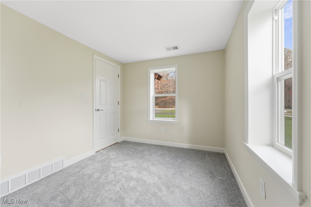3793 Ranfield Road Kent, OH 44240 - Photo 21 of 40 Unfurnished office or bedroom featuring light carpet and baseboards