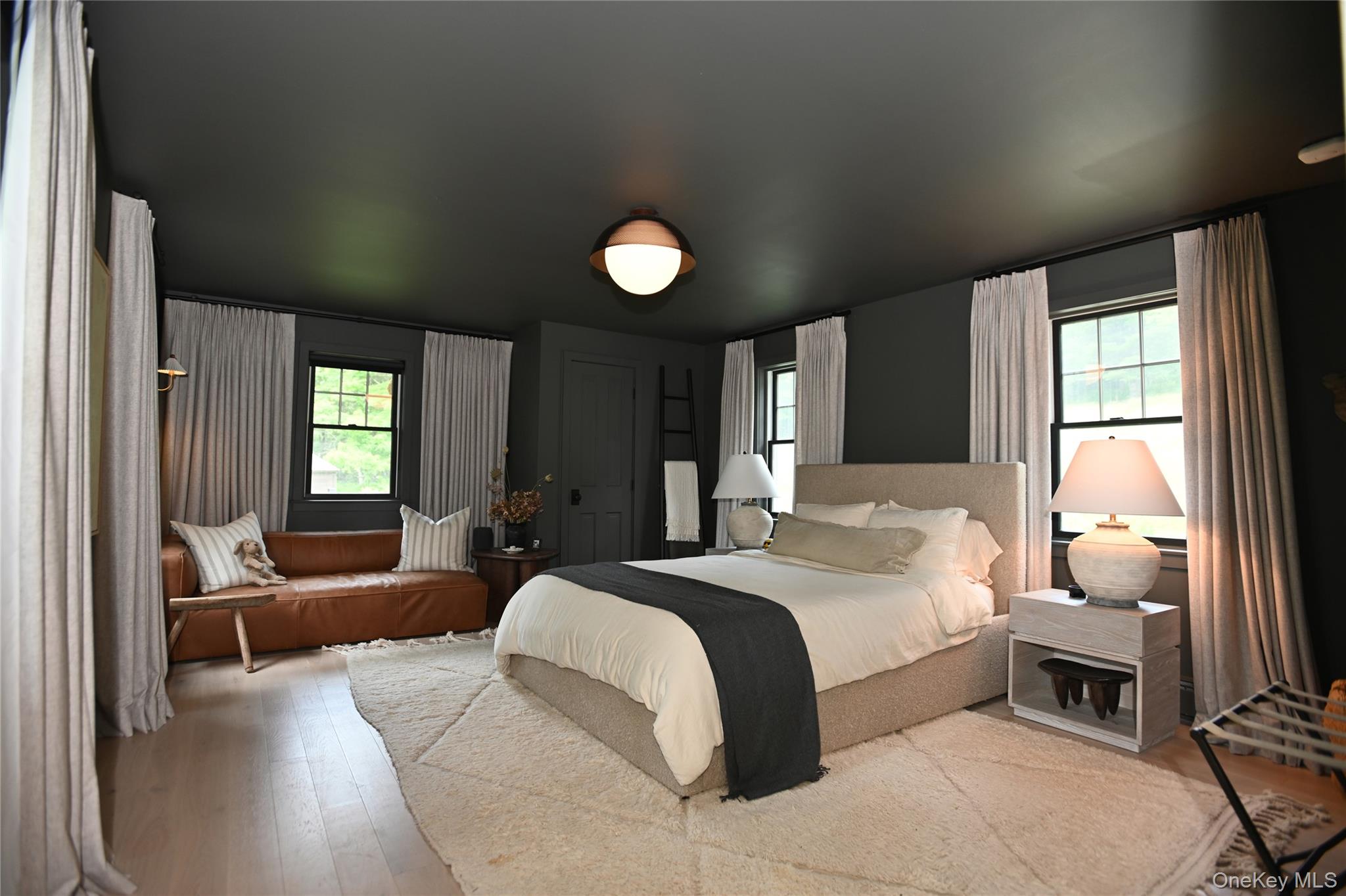 340 Upper Pine Kill Road Wurtsboro, NY 12790 - Photo 9 of 13 Down stairs bedroom with views on all sides, remote controlled lighting, hardwood floors and tranquil decor.