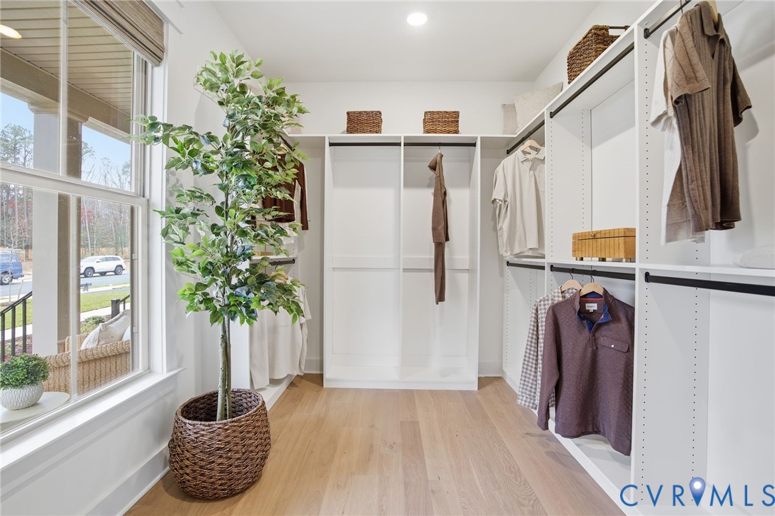 4023 Tuckmar Ridge Drive Moseley, VA 23120 - Photo 13 of 21 a view of walk in closet with clothes and shoes