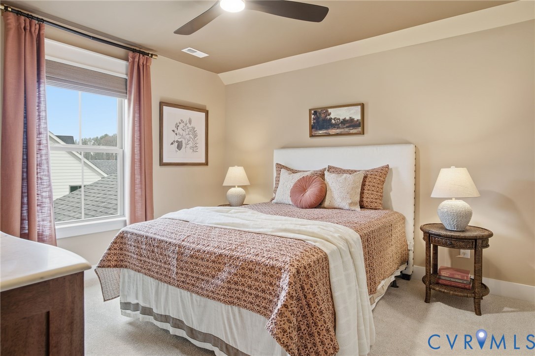 4023 Tuckmar Ridge Drive Moseley, VA 23120 - Photo 14 of 21 a bedroom with a bed and a window