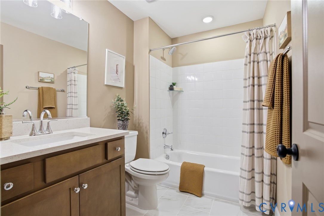 4023 Tuckmar Ridge Drive Moseley, VA 23120 - Photo 17 of 21 a bathroom with a sink a toilet and shower