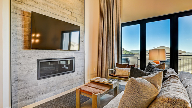2417 West High Road, Unit 2515 Park City, UT 84098 - Photo 4 of 67 Living area with a glass covered fireplace