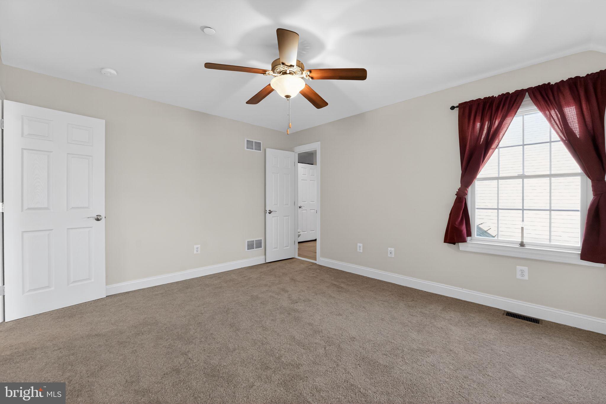 1165 Line Road Westminster, MD 21158 - Photo 37 of 75 an empty room with windows and fan