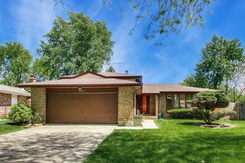 front view of a house with a garden