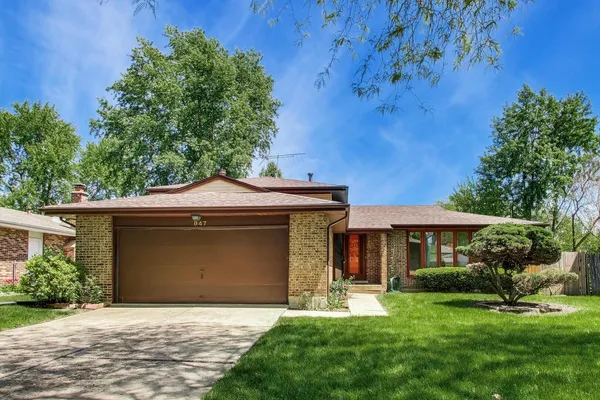 front view of a house with a garden
