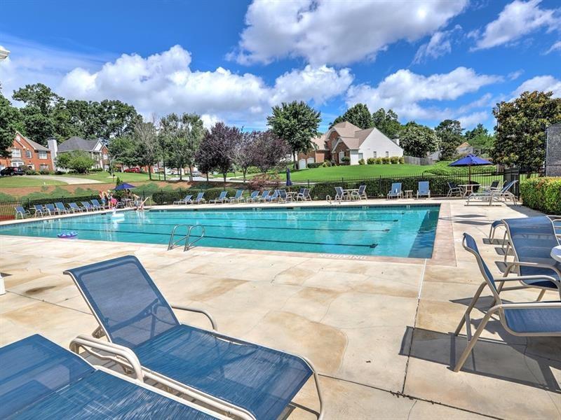 2945 Highland Pass Alpharetta, GA 30004 - Photo 28 of 29 a view of a swimming pool and lounge chairs in back of the house