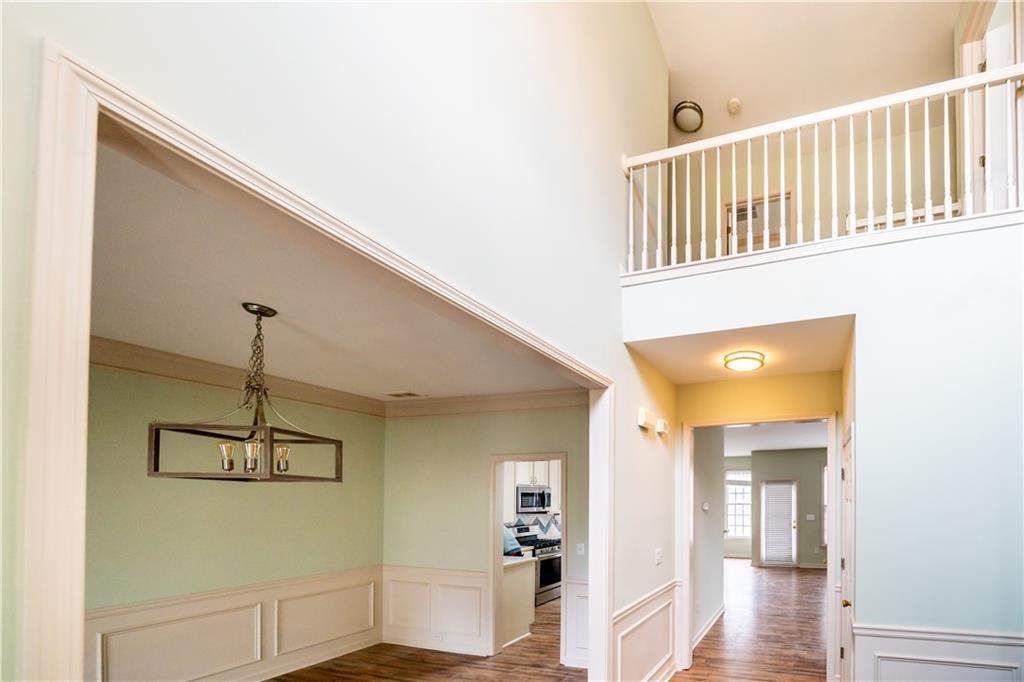 2945 Highland Pass Alpharetta, GA 30004 - Photo 5 of 29 a view of a hallway with windows and chandelier