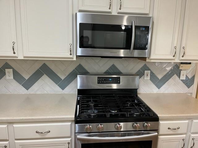 2945 Highland Pass Alpharetta, GA 30004 - Photo 7 of 29 a stove top oven sitting inside of a kitchen