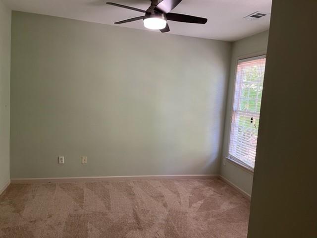 2945 Highland Pass Alpharetta, GA 30004 - Photo 10 of 29 an empty room with a window and a ceiling fan
