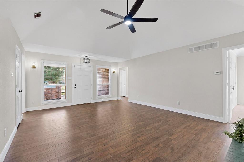 2601 Daisy Lane Rowlett, TX 75089 - Photo 5 of 36 a view of an empty room with window and wooden floor