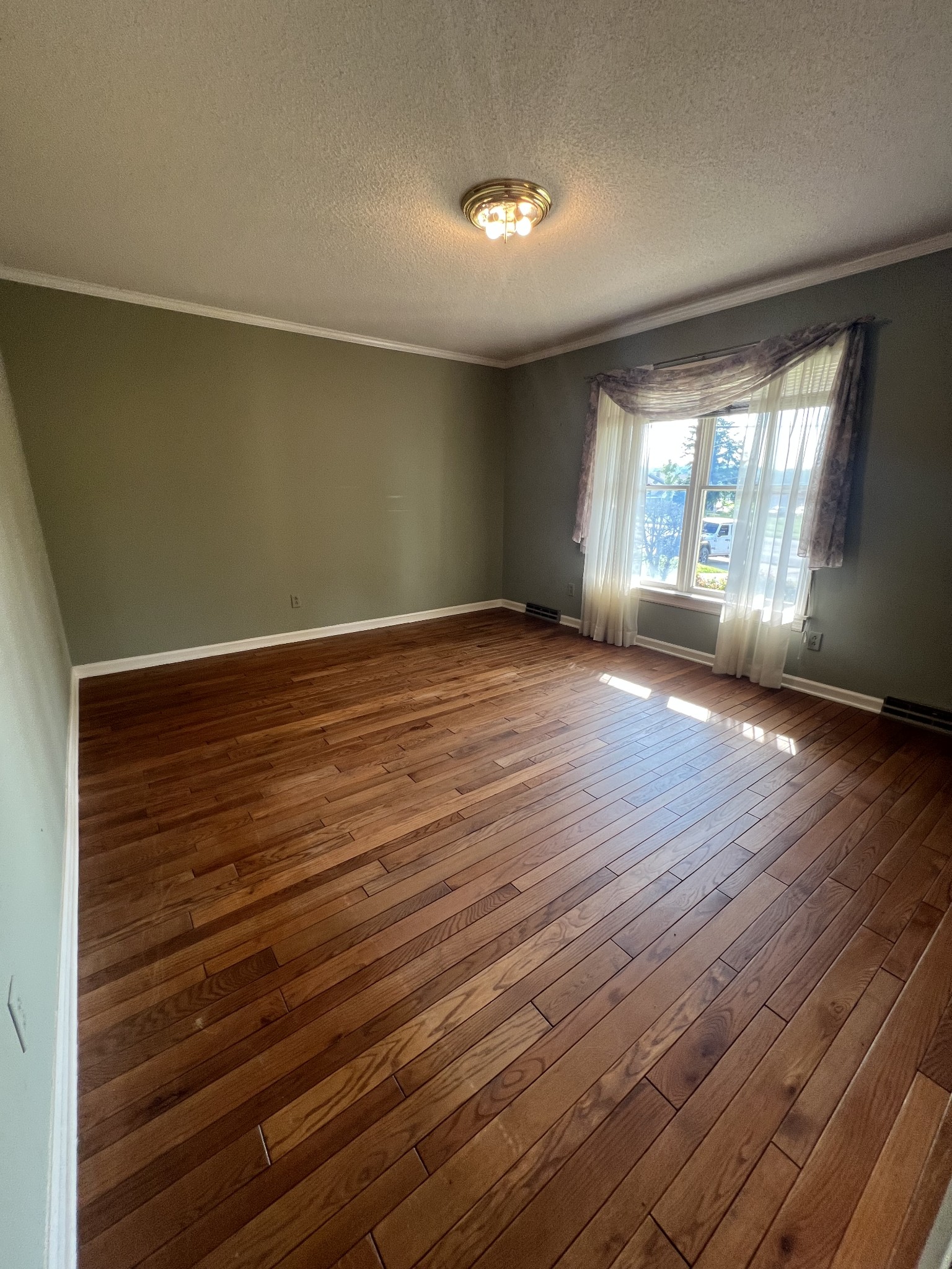 212 North 3rd Street Pulaski, TN 38478 - Photo 17 of 38 wooden floor in an empty room with a window