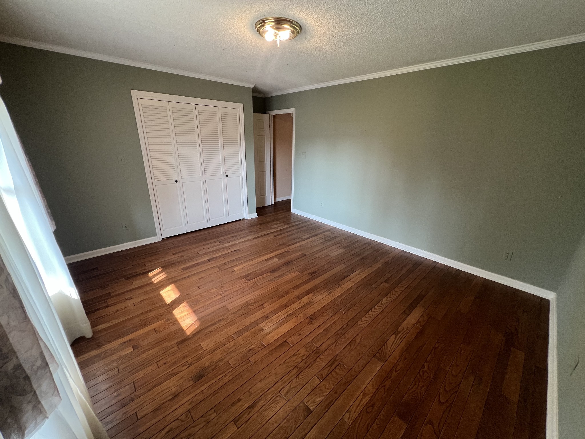 212 North 3rd Street Pulaski, TN 38478 - Photo 19 of 38 a view of empty room with wooden floor