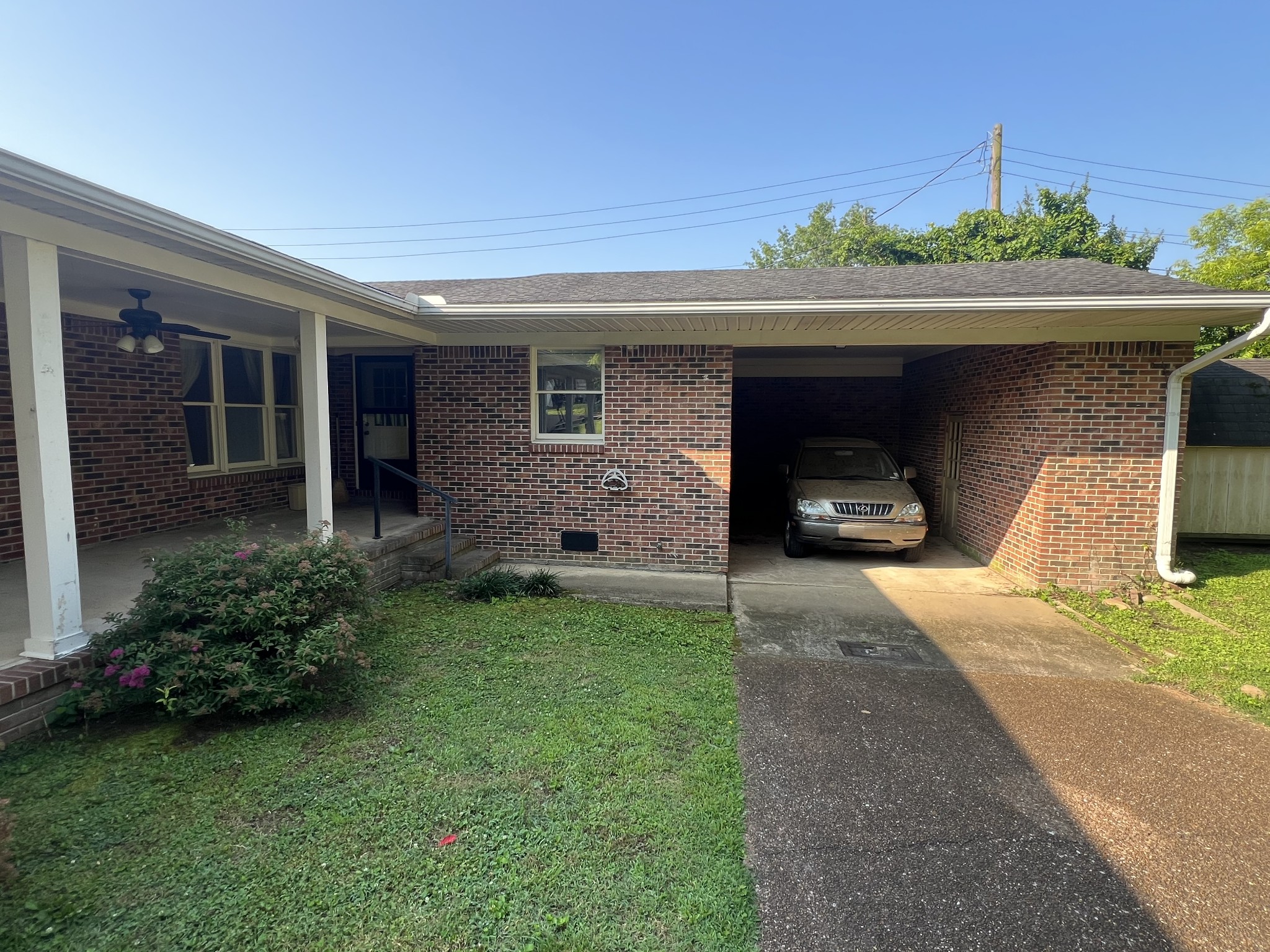 212 North 3rd Street Pulaski, TN 38478 - Photo 36 of 38 a front view of a house with a yard and garage