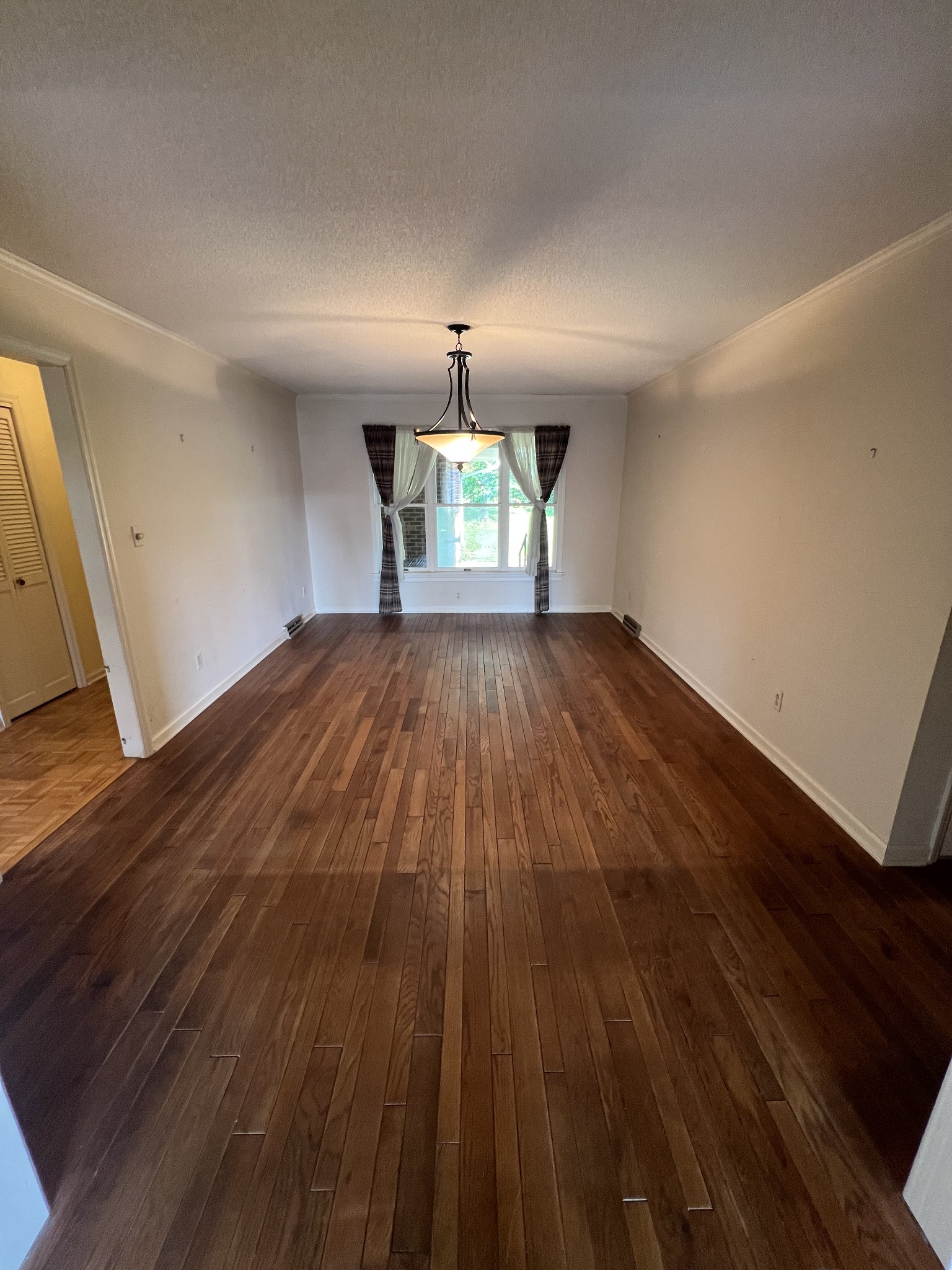212 North 3rd Street Pulaski, TN 38478 - Photo 9 of 38 wooden floor in an empty room with a window