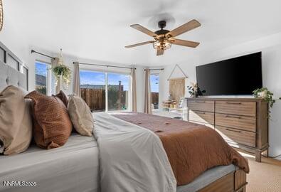 552 Spur Court Fernley, NV 89408 - Photo 25 of 46 a bedroom with a bed and a flat screen tv