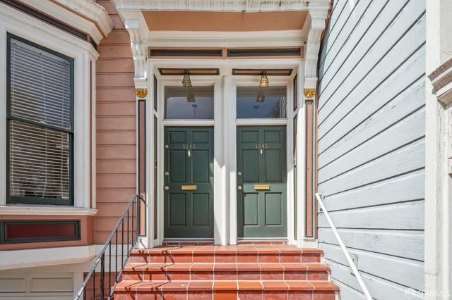 a view of hallway with wooden floor