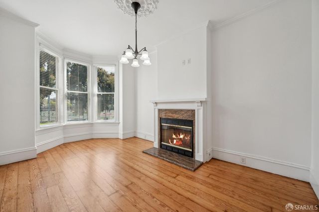 a view of livingroom with furniture wooden floor and window