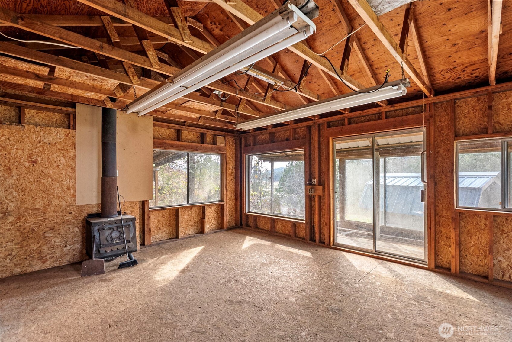 309723 Highway 101 Brinnon, WA 98320 - Photo 13 of 40 a view of an empty room with a window