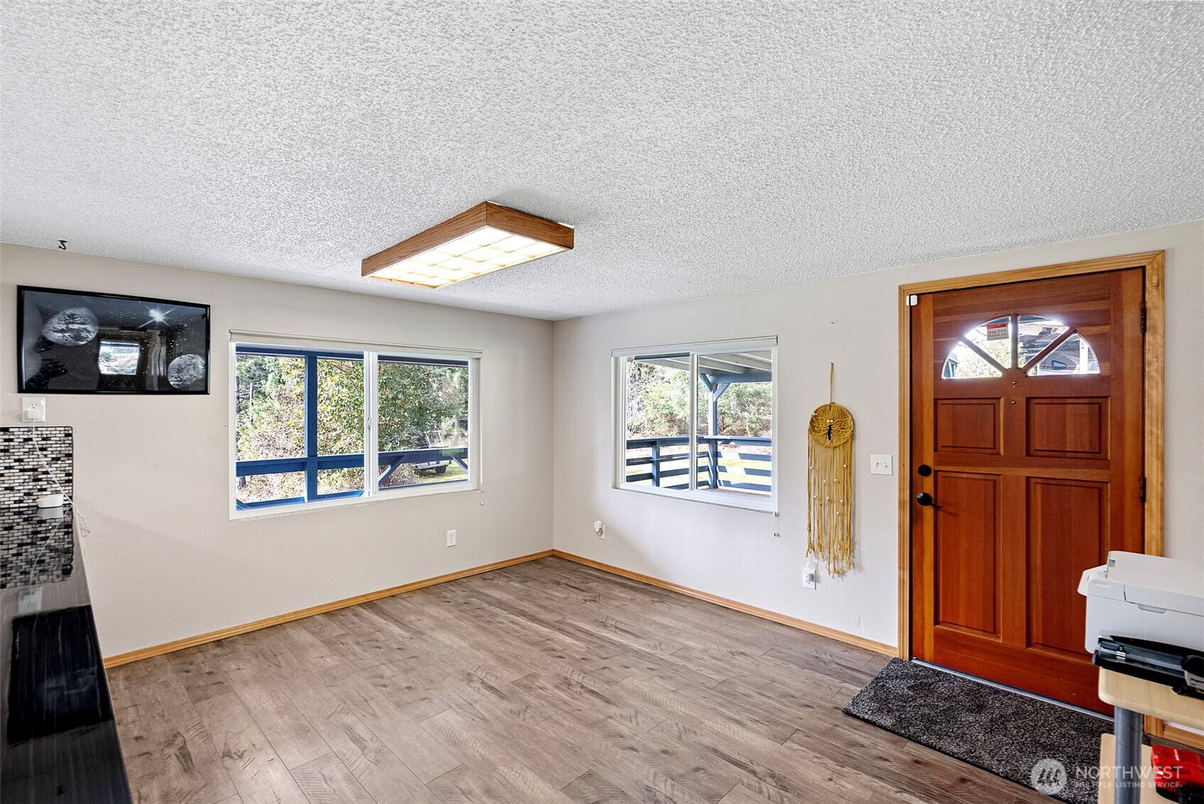 309723 Highway 101 Brinnon, WA 98320 - Photo 21 of 40 an empty room with windows and closet