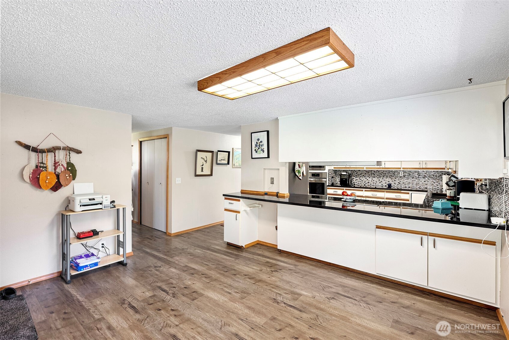 309723 Highway 101 Brinnon, WA 98320 - Photo 22 of 40 a kitchen with stainless steel appliances a sink and a refrigerator