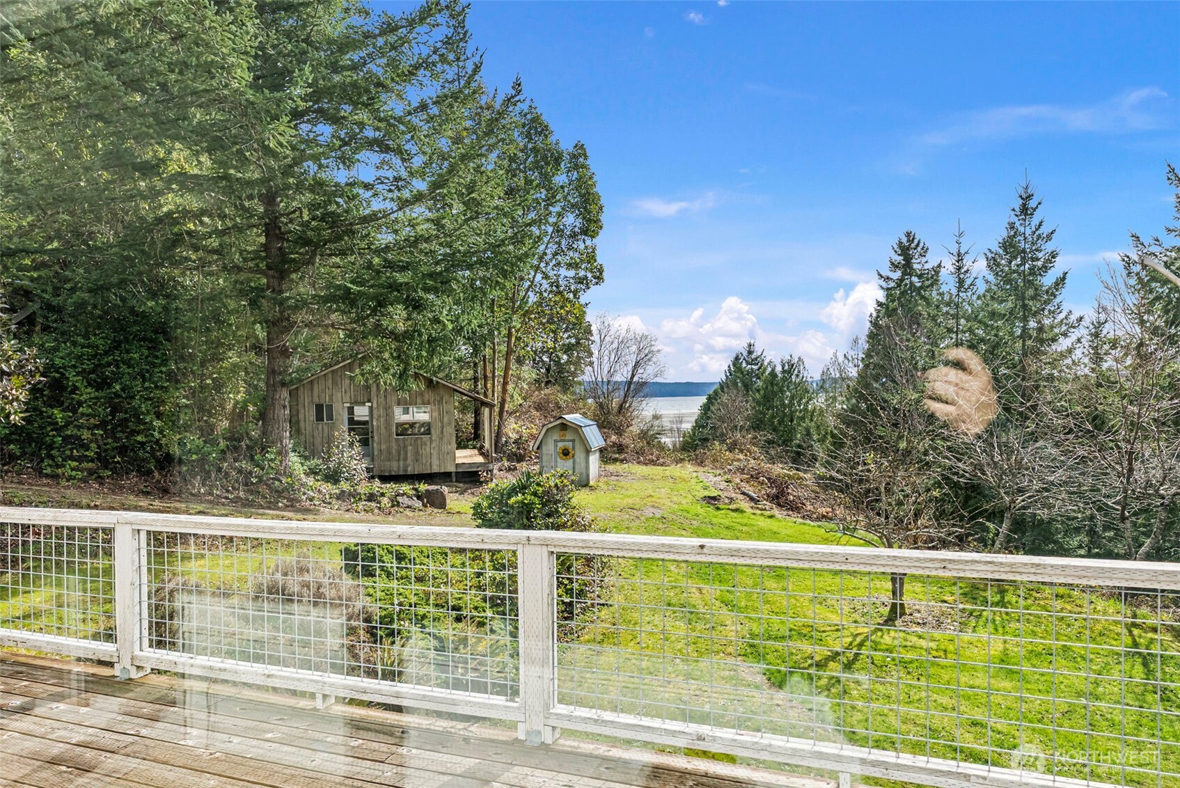 309723 Highway 101 Brinnon, WA 98320 - Photo 30 of 40 a view of outdoor space with swimming pool and trees in the background