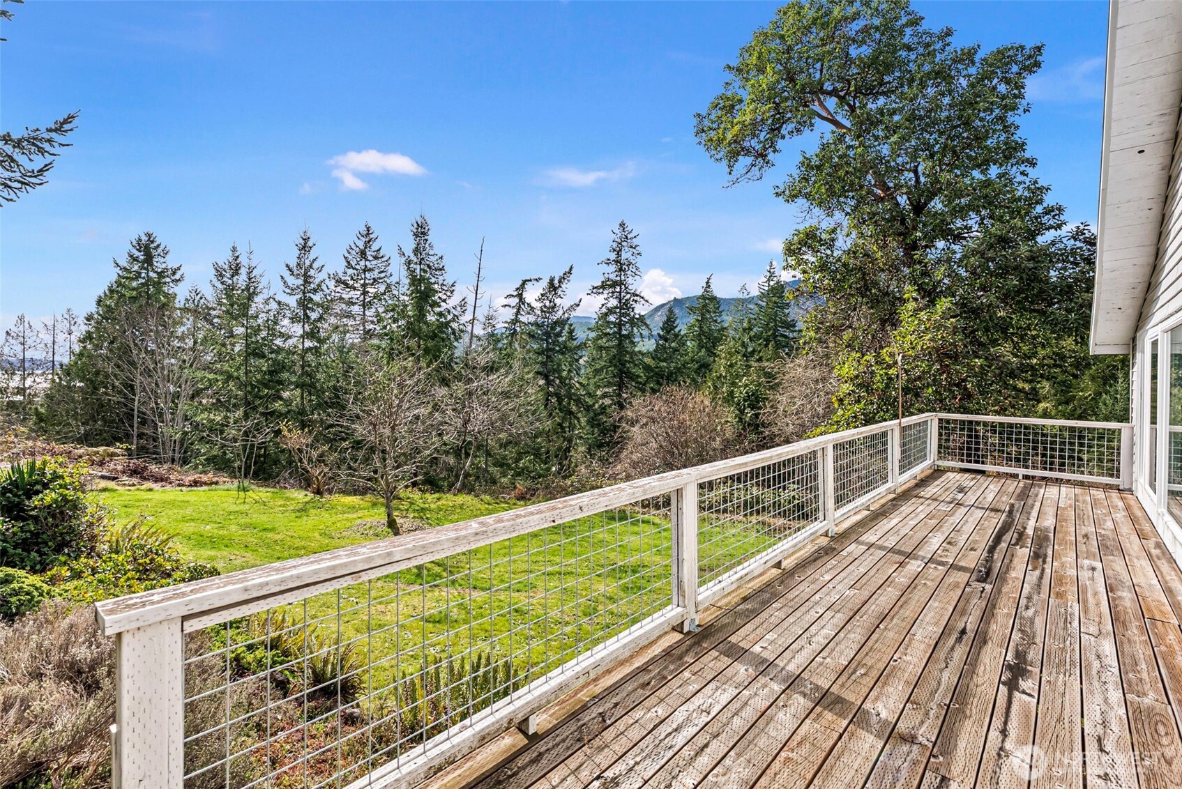 309723 Highway 101 Brinnon, WA 98320 - Photo 31 of 40 a view of balcony with wooden floor and fence