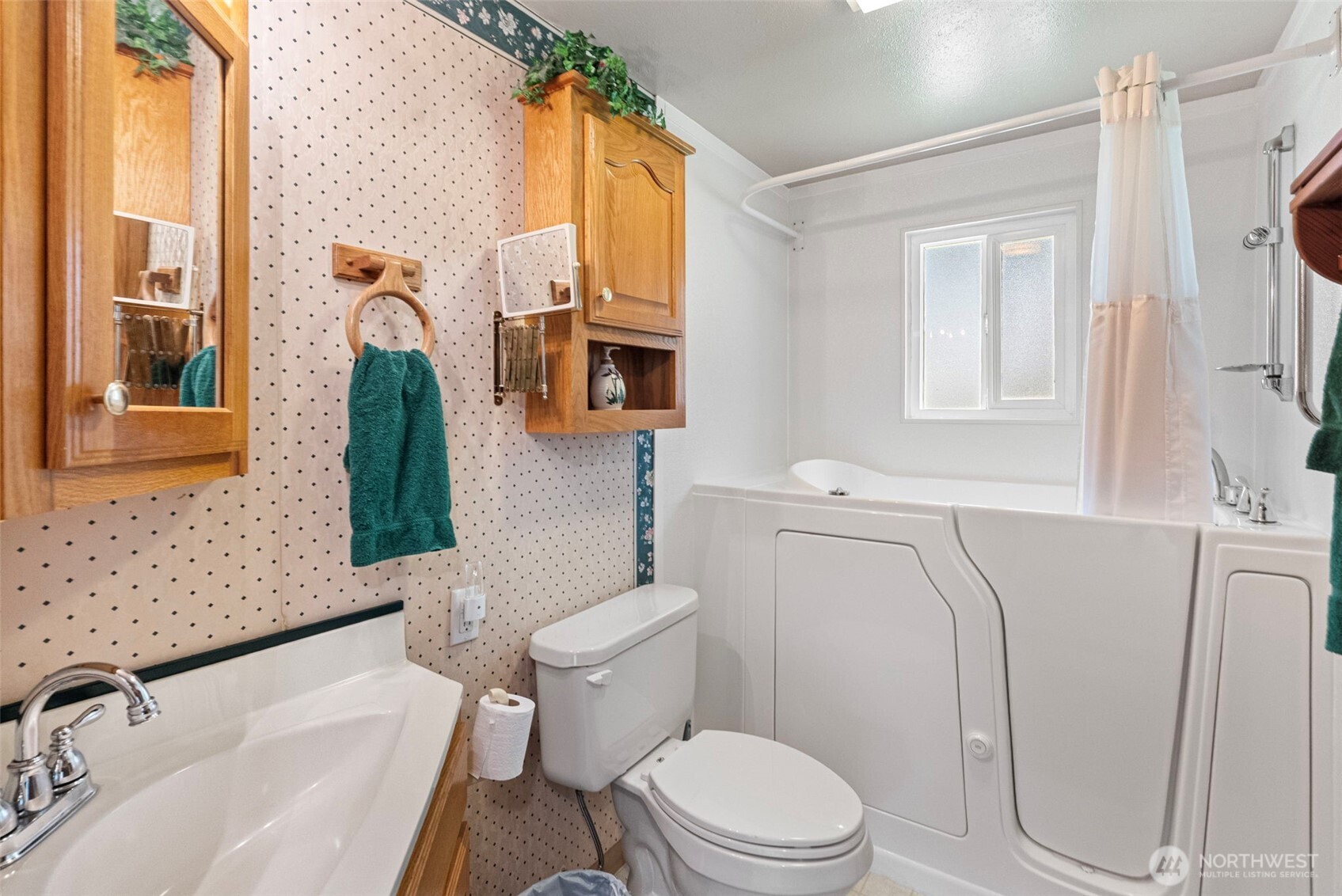309723 Highway 101 Brinnon, WA 98320 - Photo 33 of 40 a white toilet sitting next to a bathroom sink