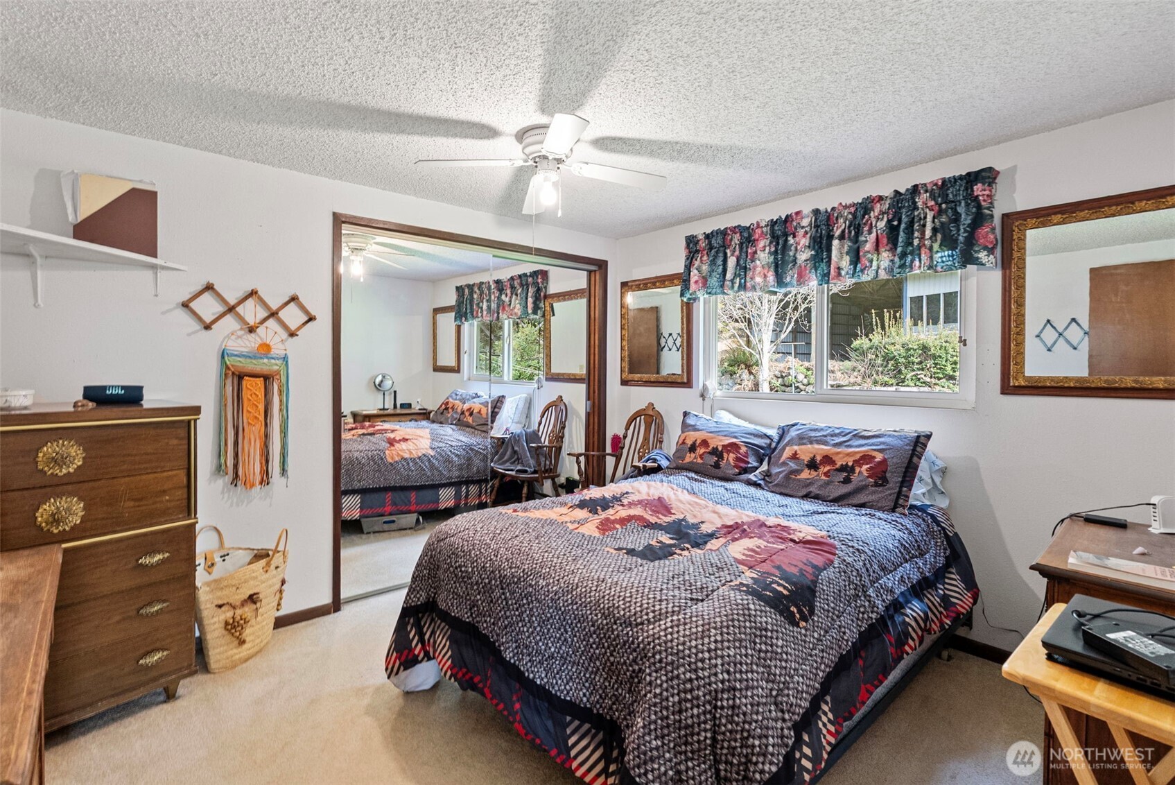 309723 Highway 101 Brinnon, WA 98320 - Photo 34 of 40 a bedroom with bed and window