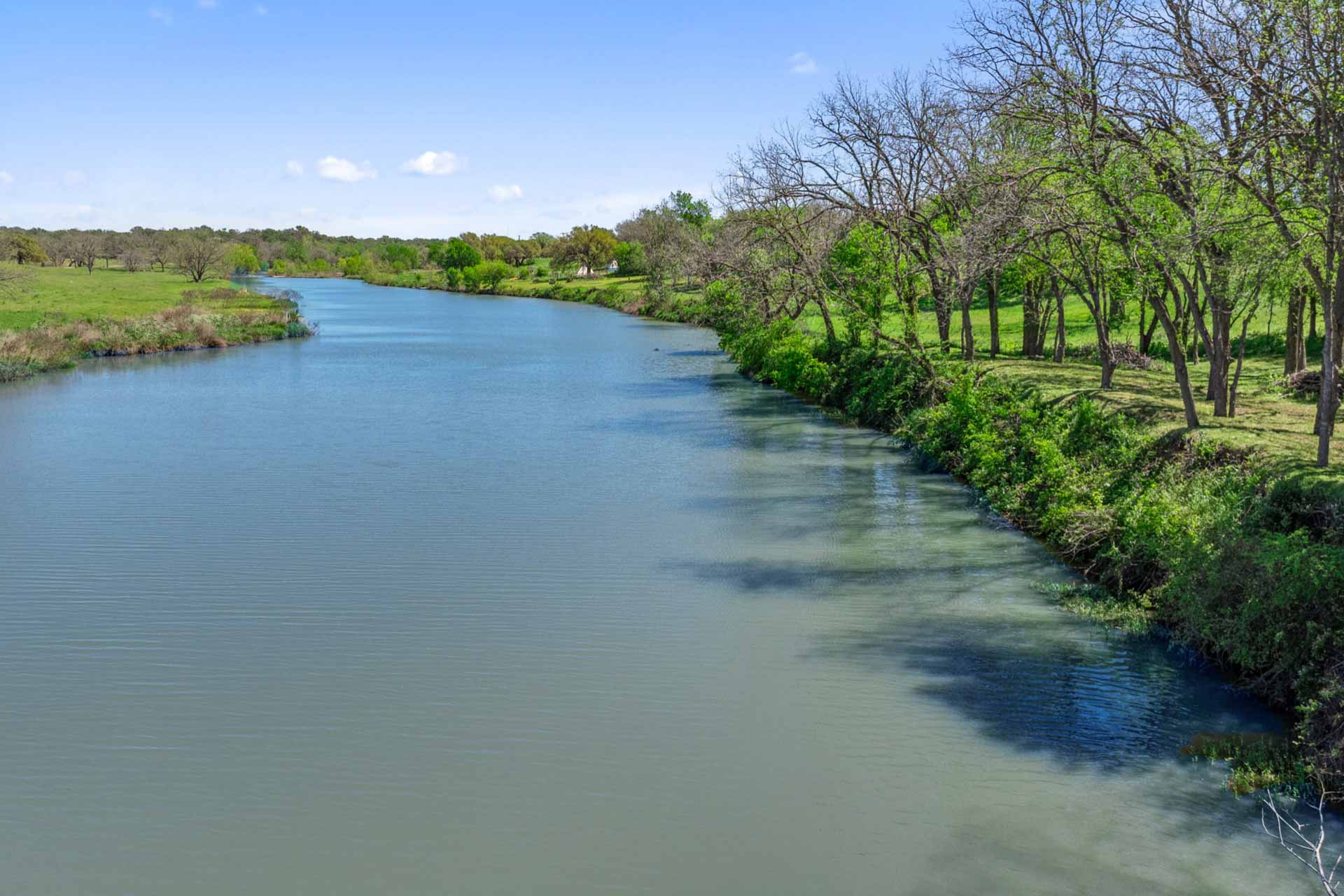 571 Ranch Road 1 Stonewall, TX 78671 - Photo 5 of 21 a view of a lake with houses in the background