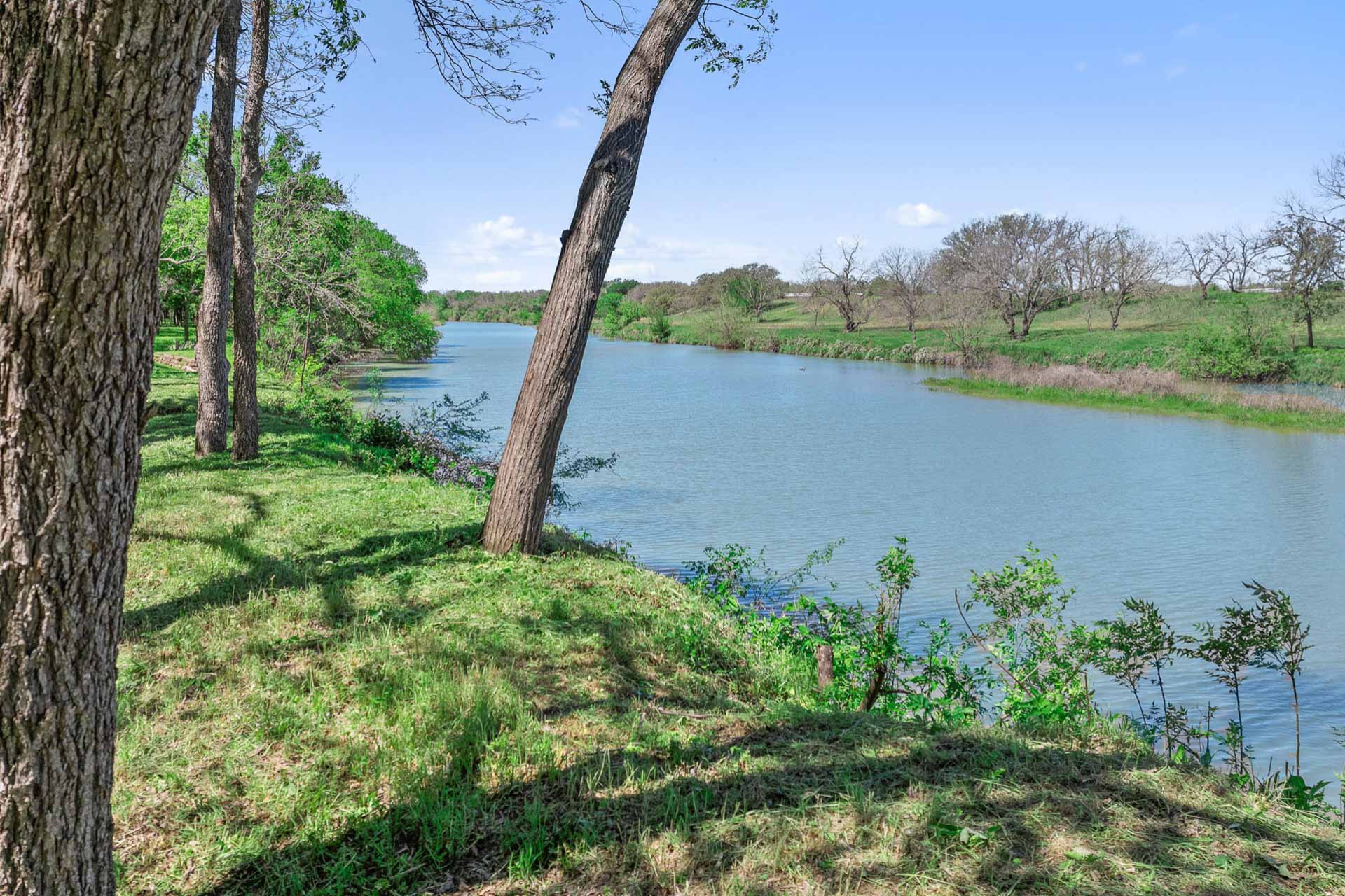 571 Ranch Road 1 Stonewall, TX 78671 - Photo 7 of 21 a view of a lake with a mountain in the background