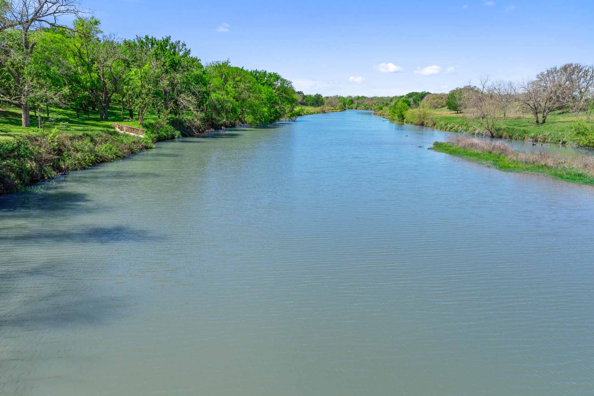571 Ranch Road 1 Stonewall, TX 78671 - Photo 10 of 21 a view of a lake with a big yard