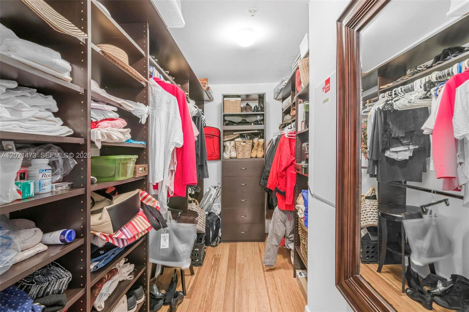 8395 Southwest 73rd Avenue, Unit 710 Miami, FL 33143 - Photo 19 of 32 a view of walk in closet with clothes