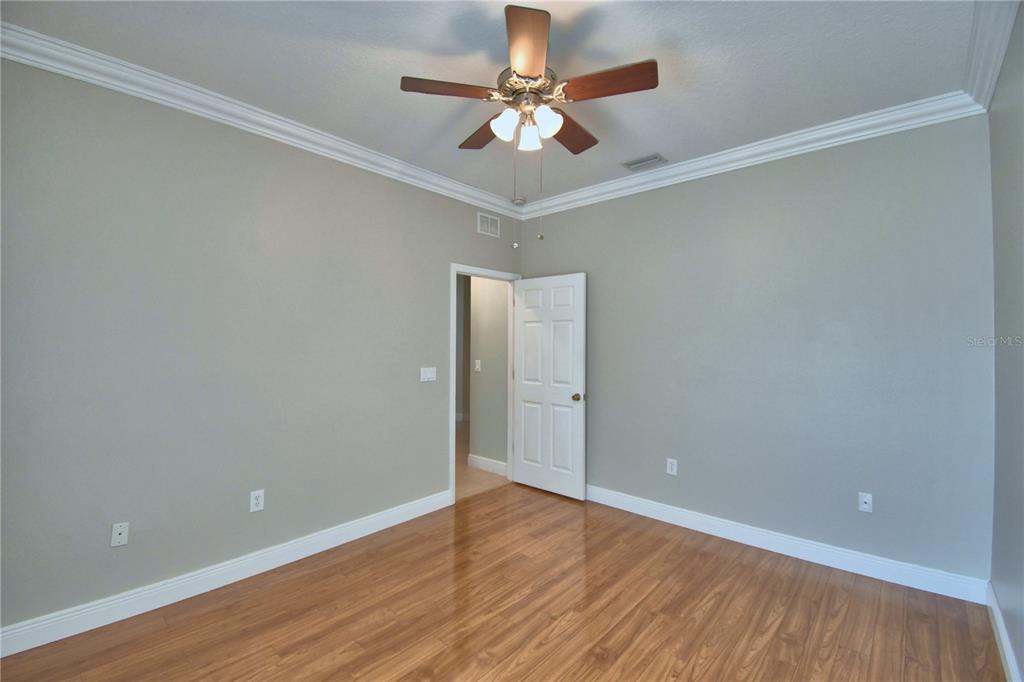 5610 Forest Ridge Drive Winter Haven, FL 33881 - Photo 11 of 70 wooden floor in an empty room with a window