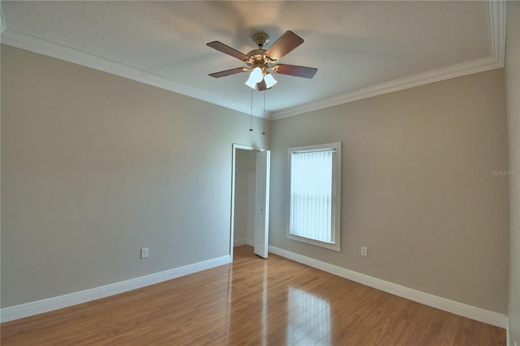 5610 Forest Ridge Drive Winter Haven, FL 33881 - Photo 13 of 70 a view of an empty room with a ceiling fan and window