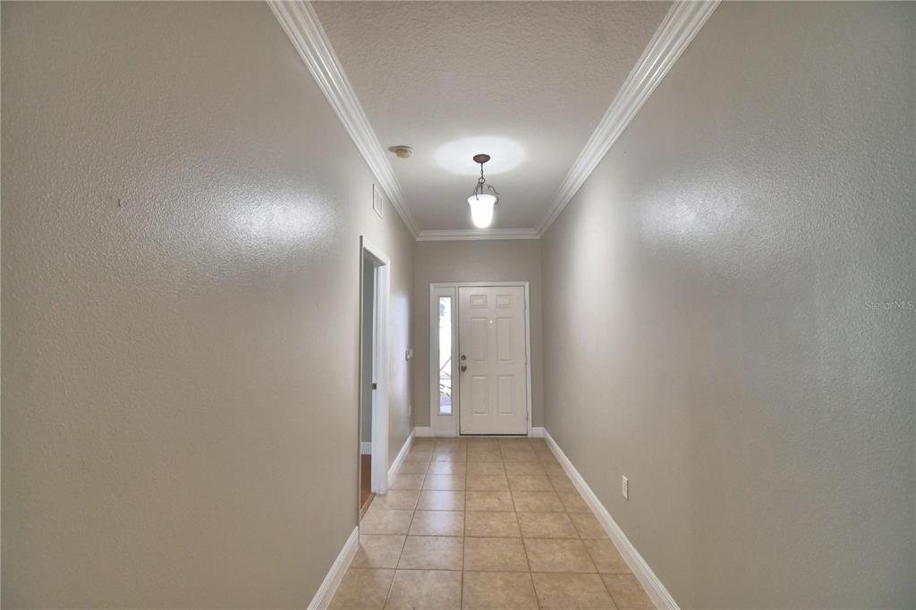 5610 Forest Ridge Drive Winter Haven, FL 33881 - Photo 27 of 70 a view of a hallway with wooden floor