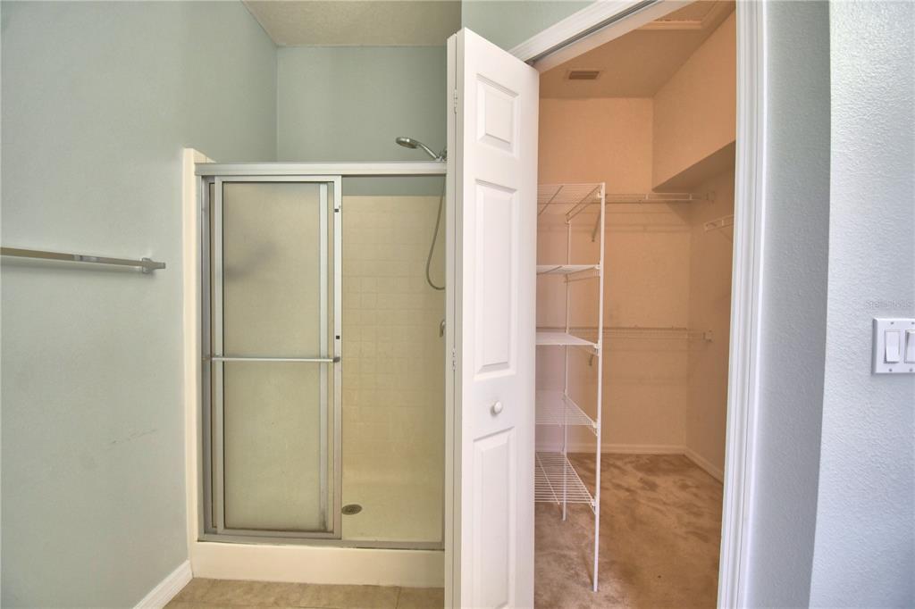 5610 Forest Ridge Drive Winter Haven, FL 33881 - Photo 29 of 70 a bathroom with a glass shower door