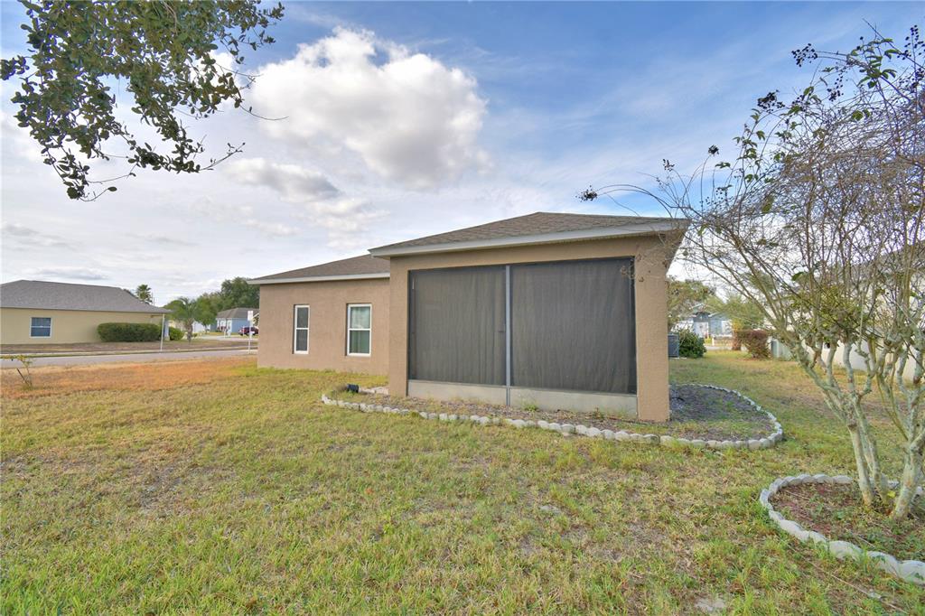 5610 Forest Ridge Drive Winter Haven, FL 33881 - Photo 30 of 70 a house with yard in front of it